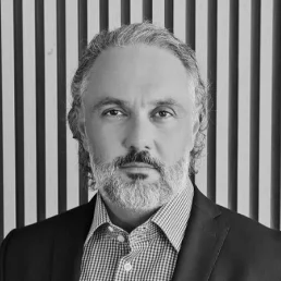 Ricardo Asse - Co-Founder & Co-CEO of Centria Partners, wearing a suit against a neutral background